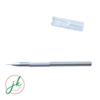 High-contrast overhead view of the durable aluminium paper piercing tool alongside its protective cap.