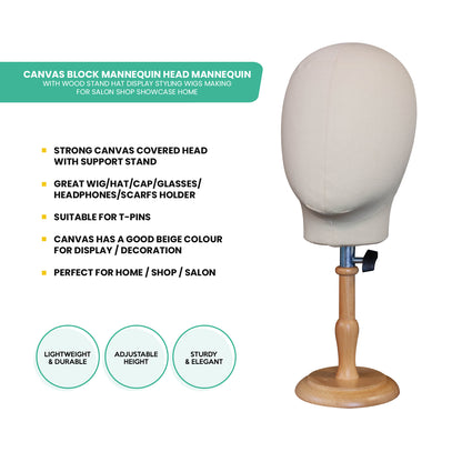 Canvas block mannequin head with wooden stand on a white background