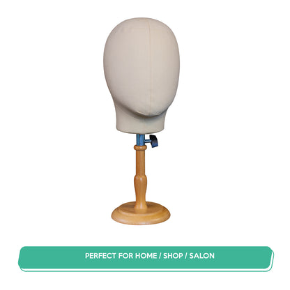 Mannequin head on a wooden stand with a white background