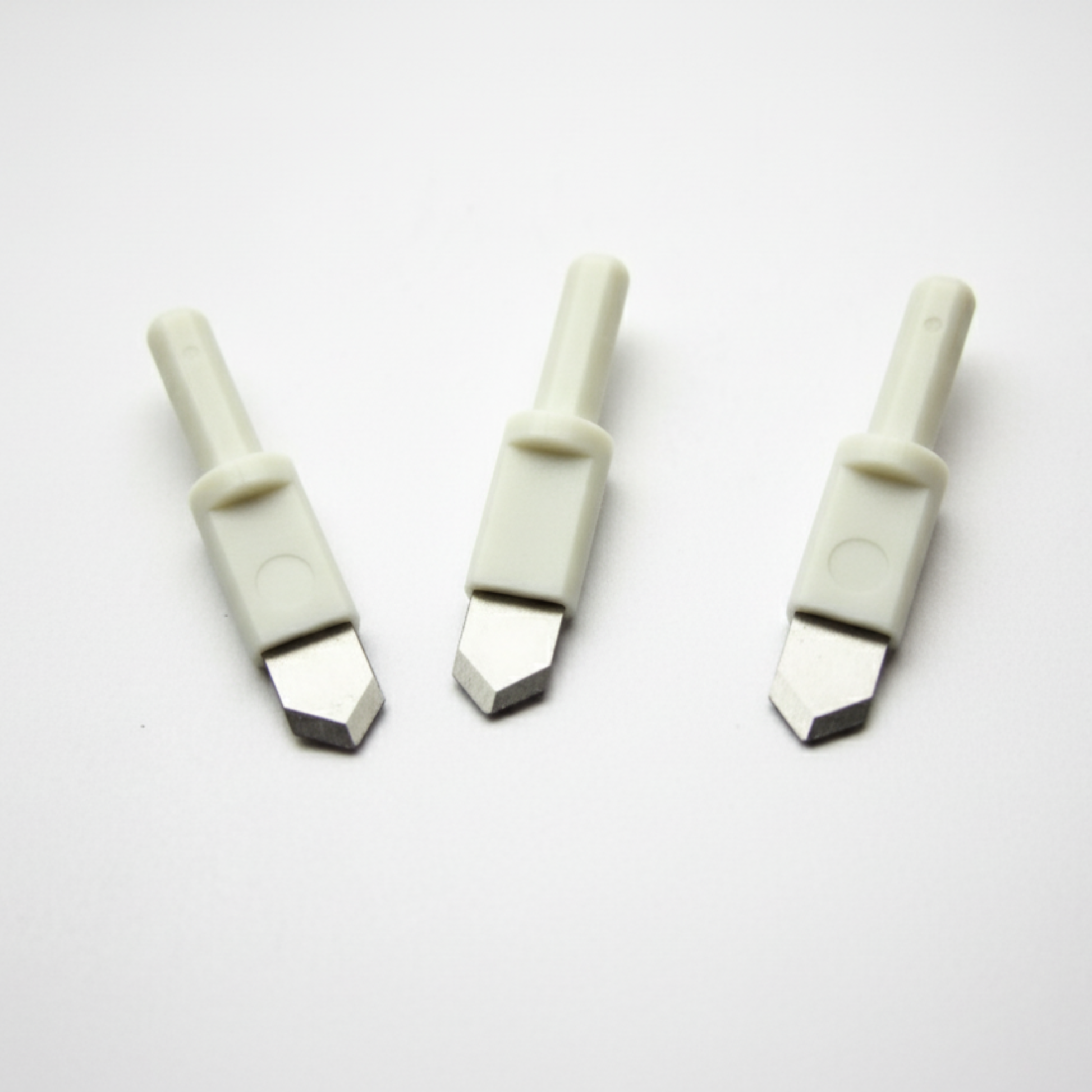 Three ultra-sharp replacement blades with white plastic safety shafts for a round circle compass paper cutter.