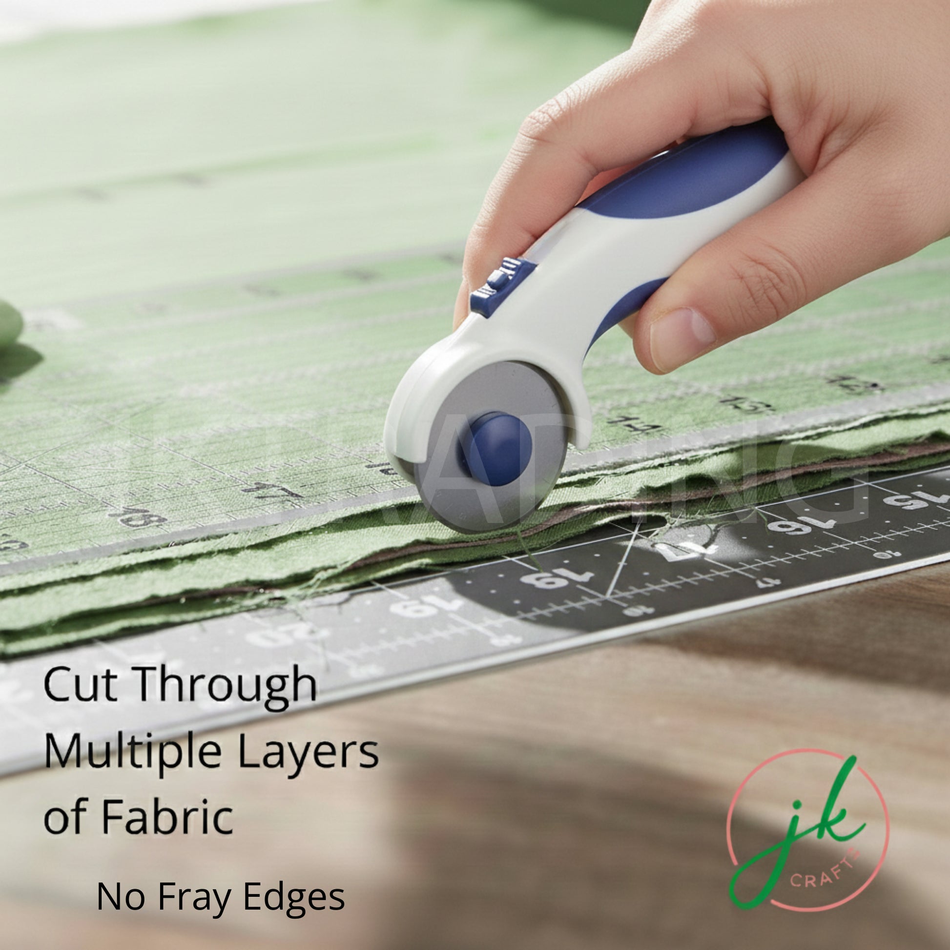 Hand smoothly gliding a blue rotary cutter along an acrylic patchwork rule to slice cleanly through layered cotton textiles.