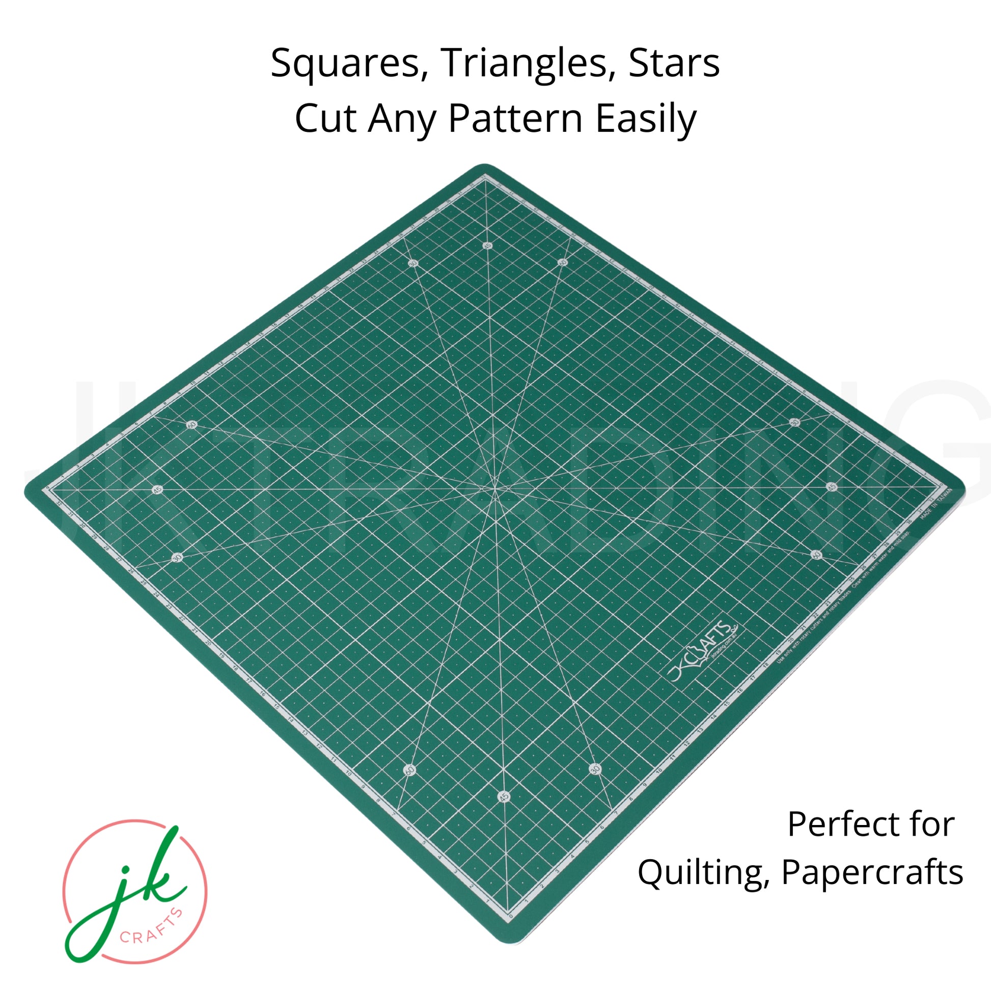 Green cutting mat with grid lines and measurements on a white background, featuring the brand 'jk crafts'.