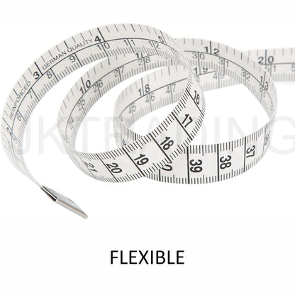 Swirling layout of a highly flexible and soft fiberglass body measurement tape isolated on a white backdrop.
