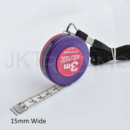 Side angle perspective of the compact purple 3m automatic tape case resting flat with the metal end tab visible.