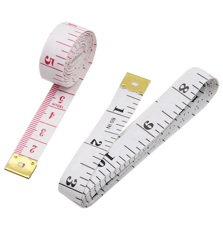 Two measuring tapes with gold ends on a white background
