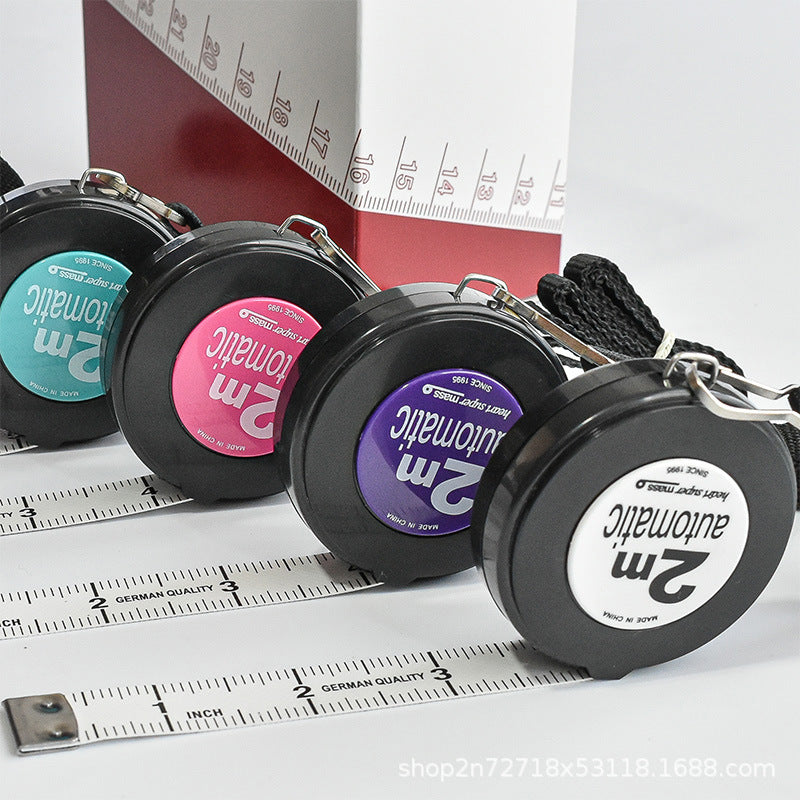 2-meter automatic retractable sewing tape measure with an attached black lanyard neck strap.