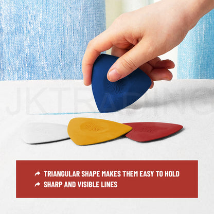 Hand holding a blue triangular tailors chalk piece demonstrating its ergonomic grip for clean line drawing.