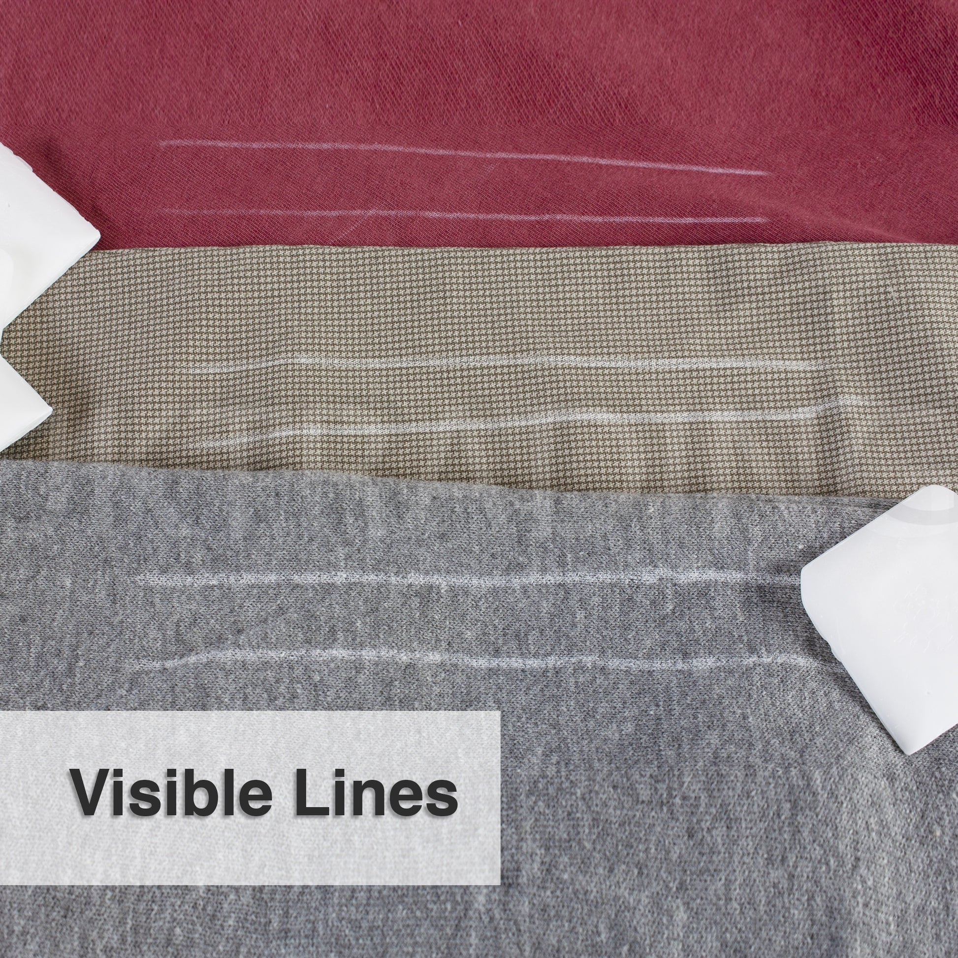Clear, highly visible white pattern lines drawn onto textured grey wool clothing material using tailors wax.