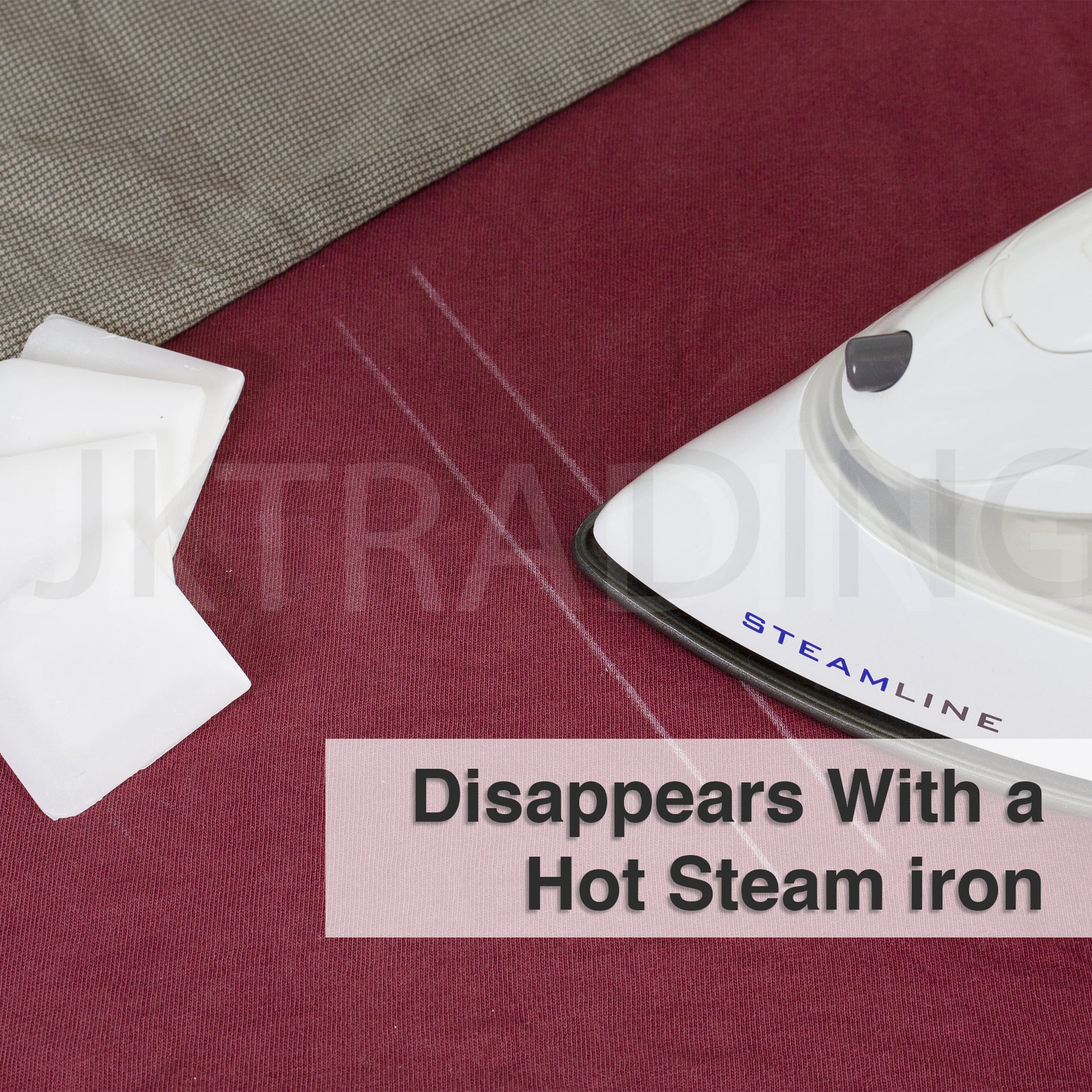 Hot steam iron pressing over fabric to demonstrate the clean heat-erasable disappearing feature of the wax lines.