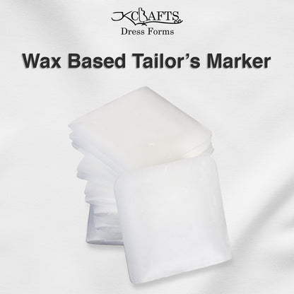 White wax-based tailors marker blocks stacked neatly next to their retail packaging box.