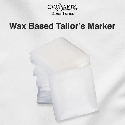 White wax-based tailors marker blocks stacked neatly next to their retail packaging box.