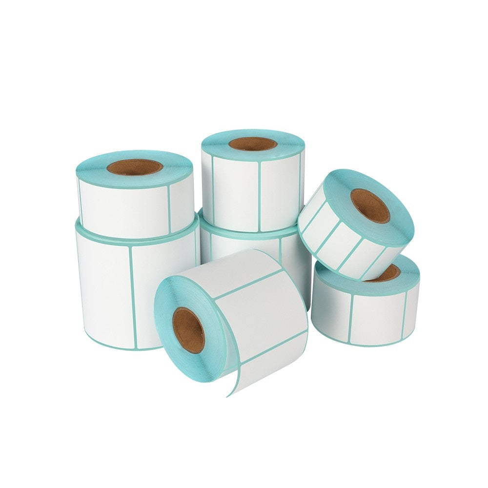Stack of white direct thermal shipping label sticker rolls with clean blue backing paper.