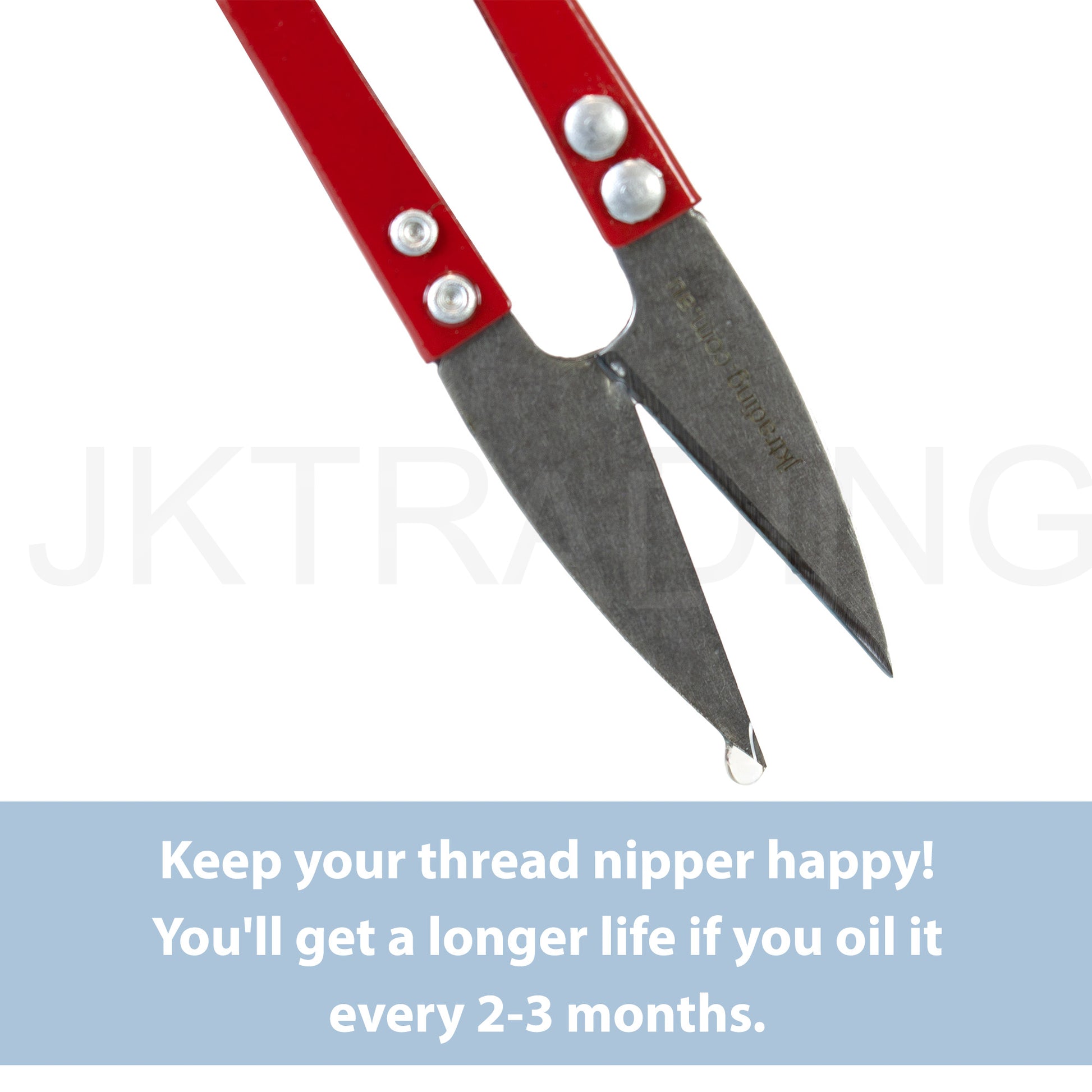 Close-up profile of the sharp pointed tip layout on a pair of professional U-shaped tailor shears.
