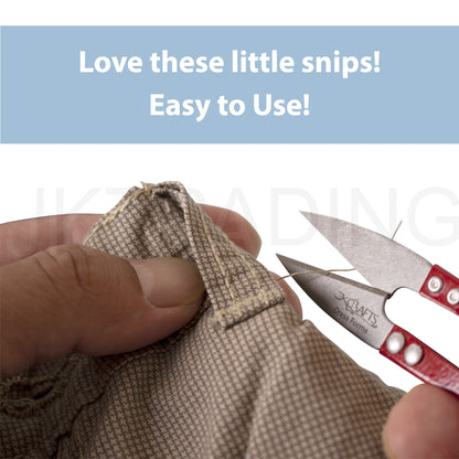 Hand operating red mini thread snips to cleanly trim loose yarn strands off a thick woven garment seam.