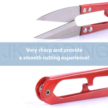 Close-up view of the razor-sharp high-carbon steel blades on a professional red sewing thread clipper.