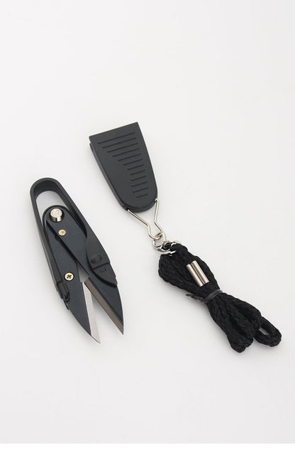 Minimalist product layout featuring the professional black thread nipper tool, its protective cap, and the lanyard cord.