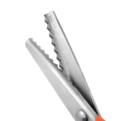 Close-up of a pair of pinking scissors on a white background
