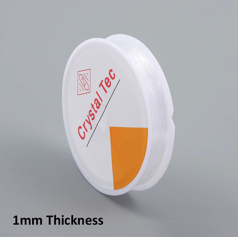 Spool of Crystal Tec thread with 1mm thickness label on a gray background