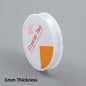 Spool of Crystal Tec thread with 1mm thickness label on a gray background